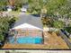 Aerial view of the home featuring a screened-in pool and a fenced backyard at 4371 Weeping Willow Cir, Casselberry, FL 32707