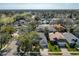 Aerial view of the neighborhood, showcasing houses surrounded by trees at 4371 Weeping Willow Cir, Casselberry, FL 32707