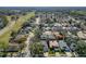 Neighborhood aerial view with tree-lined streets, well-maintained lawns, and diverse home styles at 4371 Weeping Willow Cir, Casselberry, FL 32707