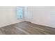 Bedroom with light gray floors, closet, natural lighting, and a large window at 4371 Weeping Willow Cir, Casselberry, FL 32707