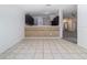 Spacious dining room features tile floors with a seamless transition into an open kitchen area at 4371 Weeping Willow Cir, Casselberry, FL 32707