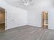 Bright main bedroom features a ceiling fan, crown molding, and light gray flooring at 4371 Weeping Willow Cir, Casselberry, FL 32707