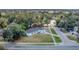 Overhead view of a home nestled among lush trees and sidewalks, offering a sense of peaceful community at 5108 Balboa Dr, Orlando, FL 32808