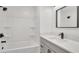 Sparkling bathroom with a shower-tub combo, modern vanity, and sleek, updated fixtures at 5108 Balboa Dr, Orlando, FL 32808