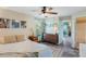 Spacious bedroom with wood floors, a ceiling fan, and a view of the outdoors at 5120 Conroy Rd # 32, Orlando, FL 32811