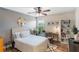 Comfortable bedroom with wood floors, natural light, and stylish decor at 5120 Conroy Rd # 32, Orlando, FL 32811