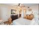 Bright bedroom with wood floors, a ceiling fan, and two dressers at 5120 Conroy Rd # 32, Orlando, FL 32811