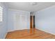 Bedroom featuring hardwood floors, closet, and entry to ensuite bathroom at 625 Brechin Dr, Winter Park, FL 32792