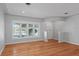 Comfortable living room featuring bright window, sleek flooring, and neutral wall paint at 625 Brechin Dr, Winter Park, FL 32792