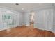 Living room featuring hardwood floors, crown molding, and a view of the adjacent kitchen at 625 Brechin Dr, Winter Park, FL 32792