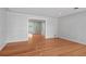 Bright and airy living room featuring hardwood floors and a doorway to another room at 625 Brechin Dr, Winter Park, FL 32792