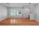 Inviting living room with bright window, sleek flooring, and neutral wall paint at 625 Brechin Dr, Winter Park, FL 32792