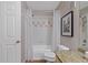 Bathroom featuring a tub and shower with tile surround and granite countertop at 6542 Swissco Dr # 813, Orlando, FL 32822