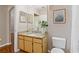 The bathroom features an elegant vanity with granite countertop and ample lighting at 6542 Swissco Dr # 813, Orlando, FL 32822