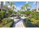 Charming garden featuring a stone fountain, lush greenery, and neatly paved walkways at 6542 Swissco Dr # 813, Orlando, FL 32822