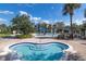 Inviting hot tub area with blue tile accents and a clear view of the community pool at 6542 Swissco Dr # 813, Orlando, FL 32822