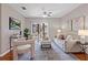 Inviting living room featuring a ceiling fan, and a sliding door to the outside at 6542 Swissco Dr # 813, Orlando, FL 32822