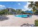 Refreshing community pool surrounded by lounge chairs and shaded seating areas at 6542 Swissco Dr # 813, Orlando, FL 32822