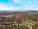 Breathtaking aerial view of the residential community nestled near the serene lake at 705 Liberty St, Eustis, FL 32726