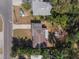 Bird's eye view of a home with a traditional roof, surrounded by lush greenery at 705 Liberty St, Eustis, FL 32726