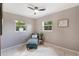 Inviting bedroom nook showcasing a chaise lounge with view of the outdoors at 705 Liberty St, Eustis, FL 32726