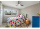 Comfortable bedroom with view of outdoors, ceiling fan, and cozy decor at 705 Liberty St, Eustis, FL 32726