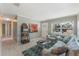 Inviting living room showcasing large front window, neutral walls, tile floors, and charming decorations at 705 Liberty St, Eustis, FL 32726