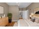 Well-lit bedroom with a large window and hardwood floors at 7123 Yacht Basin Ave # 328, Orlando, FL 32835