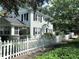 Landscaped corner lot with a white picket fence surrounding this inviting two-story home at 728 N Summerlin Ave, Orlando, FL 32803