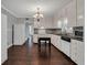 Kitchen with white cabinets, black countertop and stainless steel dishwasher at 728 N Summerlin Ave, Orlando, FL 32803