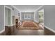 Spacious living room with decorative fireplace and a large colorful area rug on the wood floor at 728 N Summerlin Ave, Orlando, FL 32803