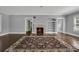 Living room featuring a brick fireplace, built-in shelves, and hardwood floors at 728 N Summerlin Ave, Orlando, FL 32803