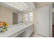 Bathroom featuring a long vanity with sink, a large mirror, and ample lighting at 7296 Sw 115Th Pl, Ocala, FL 34476