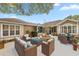 Inviting courtyard with outdoor furniture creating a relaxing space for entertaining at 7296 Sw 115Th Pl, Ocala, FL 34476