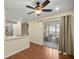 Modern kitchen with stainless steel appliances, a breakfast bar, and sliding glass doors to a screened lanai at 7296 Sw 115Th Pl, Ocala, FL 34476