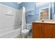 Well-lit bathroom with tub and shower combination and storage vanity at 7614 Acklins Rd, Kissimmee, FL 34747