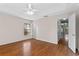 Bedroom featuring wood floors and a bonus room with glass block at 7614 Acklins Rd, Kissimmee, FL 34747