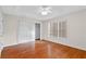 Neutral bedroom with wood floors, closet and natural light at 7614 Acklins Rd, Kissimmee, FL 34747