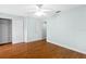 Light and airy bedroom with wood floors and a large closet at 7614 Acklins Rd, Kissimmee, FL 34747