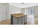 Dining area with tile flooring next to the kitchen and bright sliding doors at 7614 Acklins Rd, Kissimmee, FL 34747