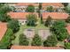 An aerial view featuring a playground, green spaces, and attractive townhomes at 7614 Acklins Rd, Kissimmee, FL 34747