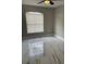 Bright, airy bedroom with marble floors and a large window at 7727 Harbor Lake Dr, Orlando, FL 32822