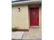 A close-up of a modern front door with glass insert and digital entry at 7727 Harbor Lake Dr, Orlando, FL 32822