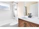 Bright bathroom featuring a shower-tub combo with modern fixtures and a stylish vanity at 8076 Aspencrest Ct, Orlando, FL 32835