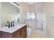 Bathroom showcasing a sleek vanity, modern fixtures, and a glass-enclosed shower at 8076 Aspencrest Ct, Orlando, FL 32835