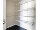 Walk-in closet featuring custom shelving and ample storage space at 8076 Aspencrest Ct, Orlando, FL 32835