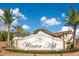 Winter Hill community sign with palm trees and blue sky at 8076 Aspencrest Ct, Orlando, FL 32835