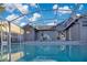 Relaxing screened-in pool and beautiful gray house at 8076 Aspencrest Ct, Orlando, FL 32835