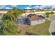 Rear view of home featuring a screened lanai, and an expansive backyard at 8076 Aspencrest Ct, Orlando, FL 32835