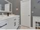 Modern bathroom features a white marble top vanity, a framed mirror, and white trim at 824 Preserve Ter, Lake Mary, FL 32746